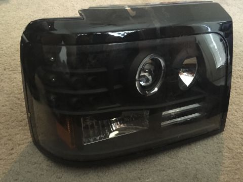 1996 Ford Bronco - Aftermarket headlight assembly shown up close, not a complete vehicle.