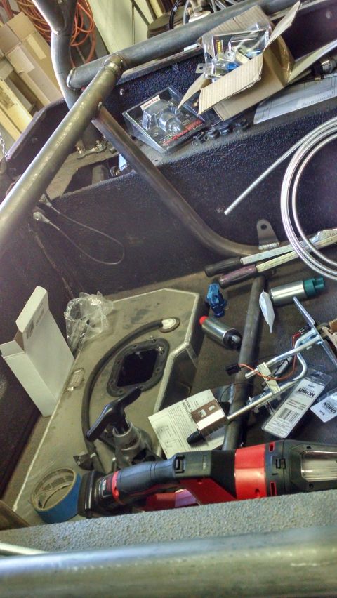 1985 Jeep CJ7 - Parts and tools are laid out inside a vehicle, possibly for a repair or modification project.