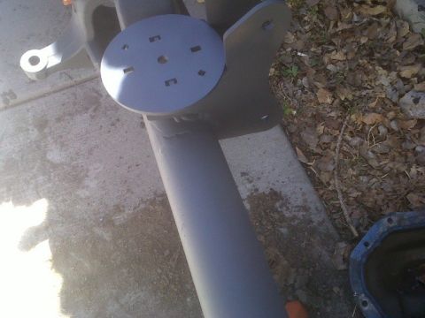 1979 Ford Bronco - Close-up of a painted axle assembly, likely for a vehicle, with a circular mounting plate visible.