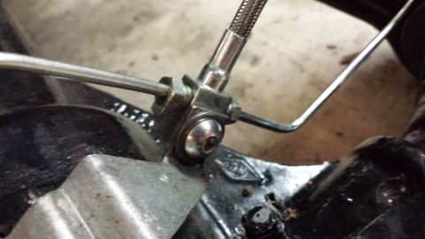 1978 Ford Bronco - Brake caliper and line assembly detail shot.