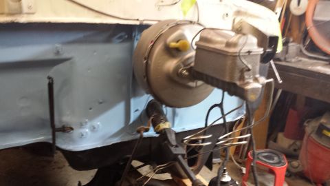 1978 Ford Bronco - Close-up view of a vehicle's brake booster and master cylinder assembly, likely during a repair or restoration.