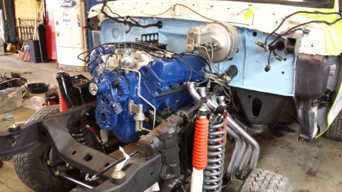 1978 Ford Bronco - The engine and chassis of a vehicle are shown during a restoration or build process.