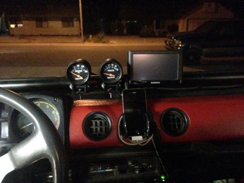 1987 Suzuki Samurai - Interior view of a dashboard with two circular gauges visible.