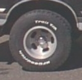1978 Ford Bronco - Close-up of a tire and wheel assembly on a vehicle.