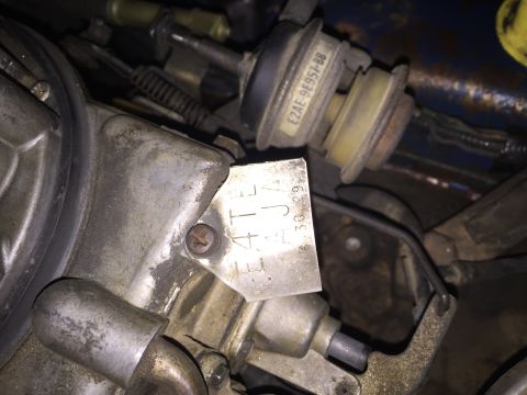 1984 Ford Bronco - Carburetor part with stamped identification numbers visible.