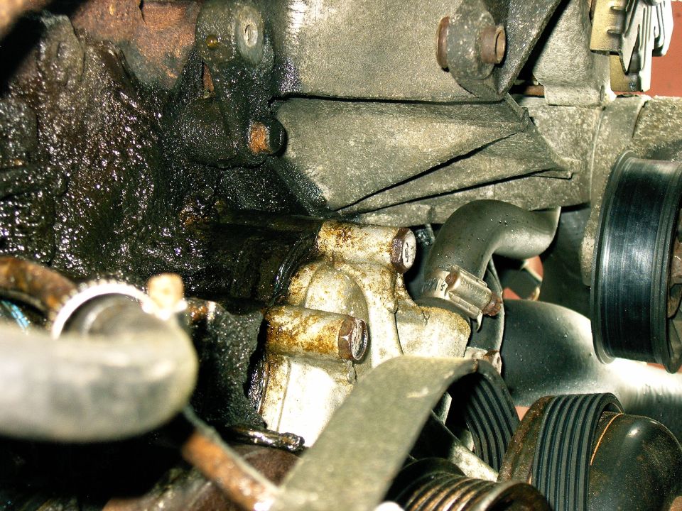 Engine part with oil leak and pulley system