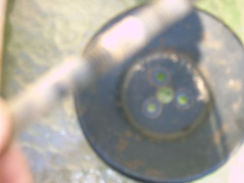 1992 Ford F-150 - Smog pump component with visible green circular openings and Supermotors.net branding.