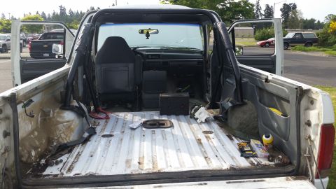 1993 Ford Bronco - Interior view of a 1993 Ford Bronco, showing the cargo bed and cab.