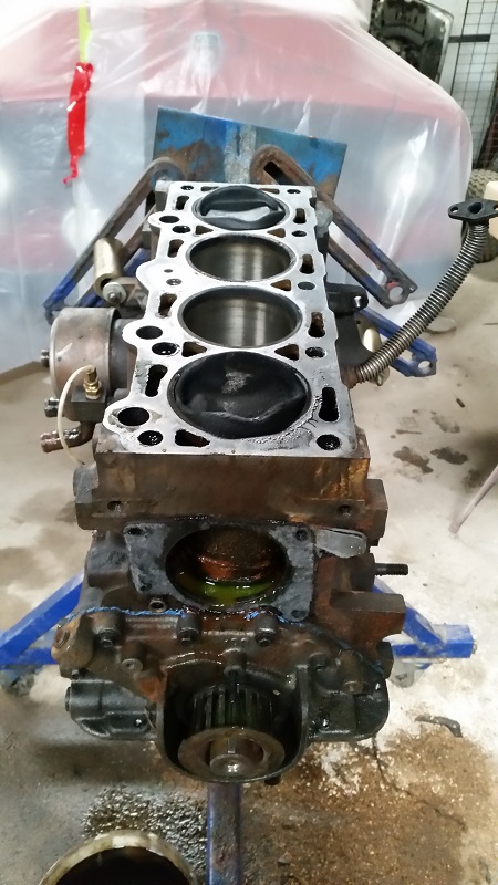 1985 Ford Escort - This engine block is disassembled and mounted on a stand for repair or inspection.