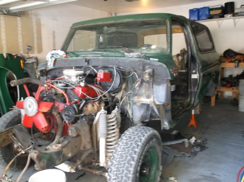 1979 Ford Bronco - This 1978 Ford Bronco is undergoing repairs in a garage, showing its disassembled front end and engine.