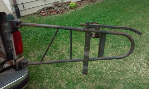 2004 Acura TL - A metal carrier is attached to the rear of a truck's tailgate.
