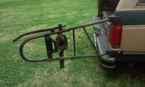 2004 Acura TL - A spare tire carrier is mounted to the rear of a pickup truck.