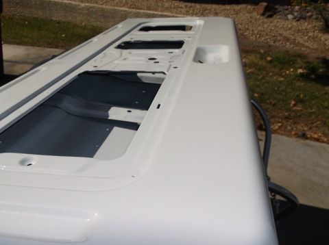 1979 Ford Bronco - Interior view of a white vehicle hardtop, showing mounting points and floor panels.