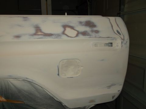1979 Ford Bronco - This vehicle's rear quarter panel is being prepped for paint, revealing its body style.