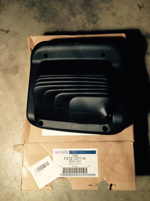 1995 Ford Bronco - A Ford transfer case boot assembly is shown in its box, with part number F2TZ-7277-A visible.