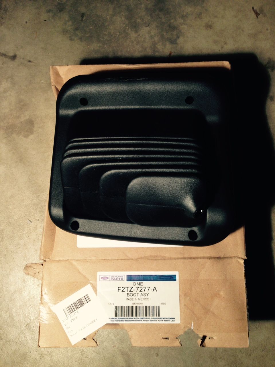 Black rubber transfer case boot assembly in its original Ford packaging