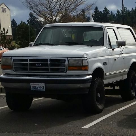 1993 Ford Bronco - This white Ford Bronco appears to be from the early 1990s, not a 1993 model as claimed.