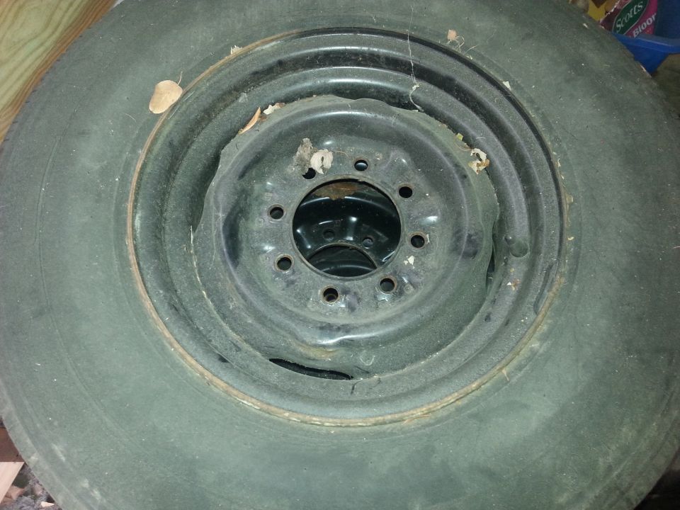 Spare tire and steel rim, showing bolt pattern