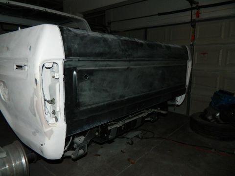 1979 Ford Bronco - The rear of a 1978 Ford Bronco is shown in a garage, undergoing bodywork.