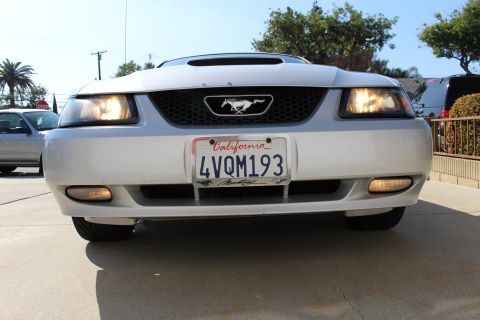 2002 Ford Mustang - Front view of a silver 2002 Ford Mustang, showing the grille, headlights, and California license plate.