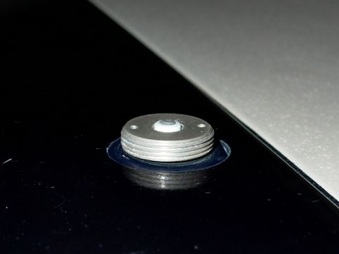 1990 Ford Bronco - A silver roof mount with a white insert is visible on a dark surface.