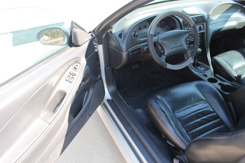 2002 Ford Mustang - Interior view of a 2002 Ford Mustang, highlighting the driver's side and dashboard.