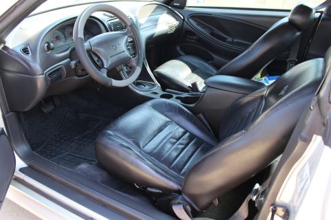 2002 Ford Mustang - Interior view of a 2002 Ford Mustang, highlighting the driver's side and front passenger seats.