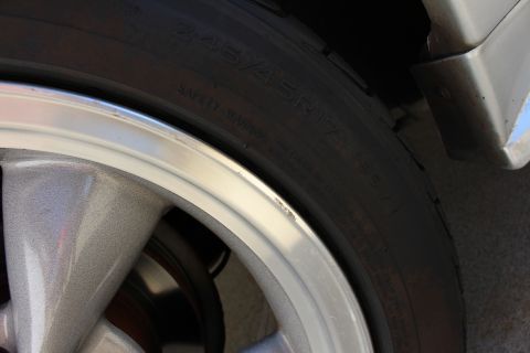 2002 Ford Mustang - A close-up view of a wheel and tire assembly, showing the tire size 245/45R17, consistent with a 2002 Ford Mustang.