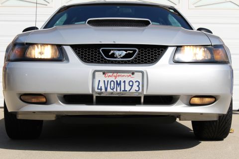 2002 Ford Mustang - Front view of a silver 2002 Ford Mustang, its iconic grille and headlights.