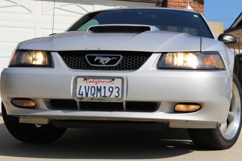 2002 Ford Mustang - Front view of a silver 2002 Ford Mustang, showing the grille, headlights, and license plate.