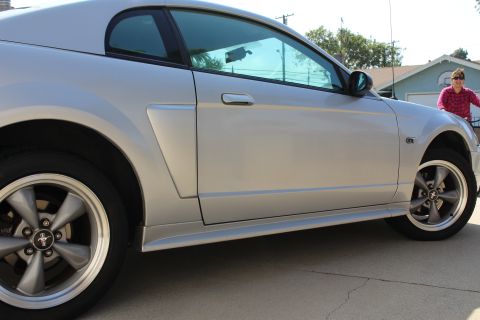 2002 Ford Mustang - Side view of a silver 2002 Ford Mustang coupe.