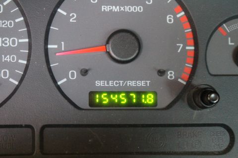 2002 Ford Mustang - The odometer displays 154,571.8 miles on this vehicle's dashboard.