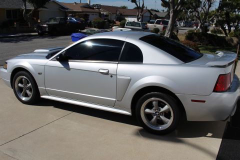 2002 Ford Mustang - This silver 2002 Ford Mustang GT coupe is shown from a three-quarter front side angle.