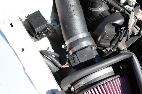 2002 Ford Mustang - Close-up view of a K&N intake system installed on a vehicle's engine.