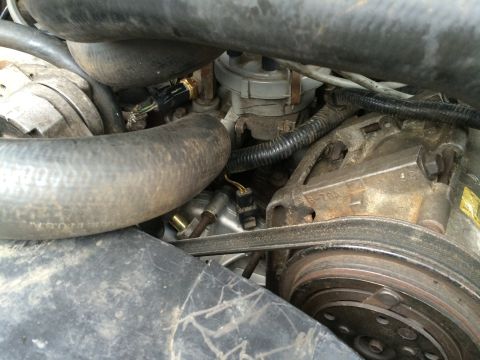 1989 Ford Bronco - Close-up view of engine components including hoses, belts, and sensors, with a SuperMotors.net watermark.
