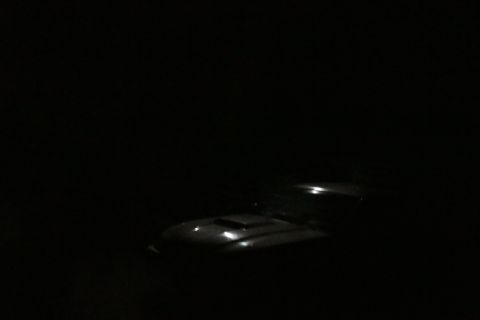 2002 Ford Mustang - The hood scoop of a 2002 Ford Mustang is visible in this nighttime photo.