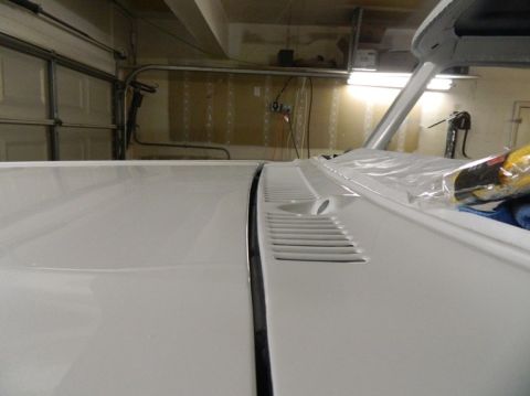 1979 Ford Bronco - Close-up view of the cowl vents on a white vehicle.