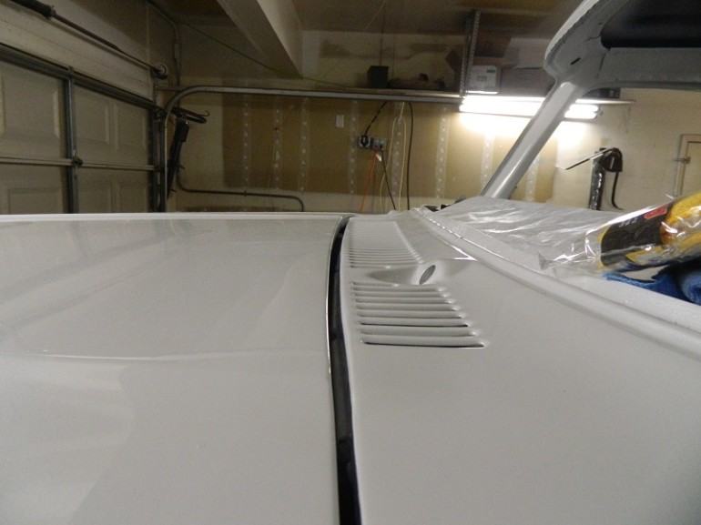 White vehicle hood and cowl detail with louvers