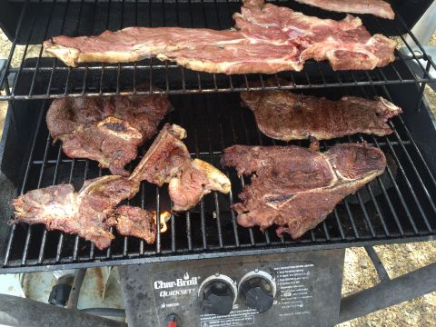 1996 Ford Bronco - Various cuts of steak are grilling on a Char-Broil QuickSet gas grill.