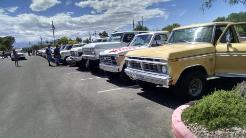 1979 Ford Bronco - Several classic Ford trucks and Broncos are parked in a line at an outdoor event.