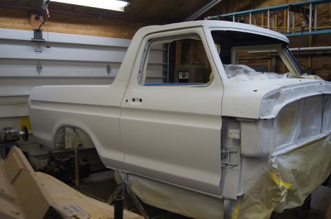 1979 Ford Bronco - This 1979 Ford Bronco is undergoing restoration in a garage, showing its body in primer.