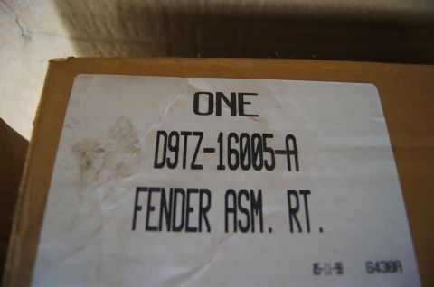 1979 Ford Bronco - A box labeled as a right fender assembly, with a part number and "Supermotors.net" visible.