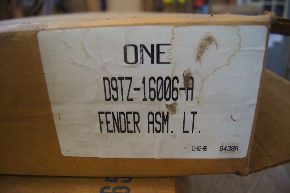 Cardboard box with label for a left fender assembly