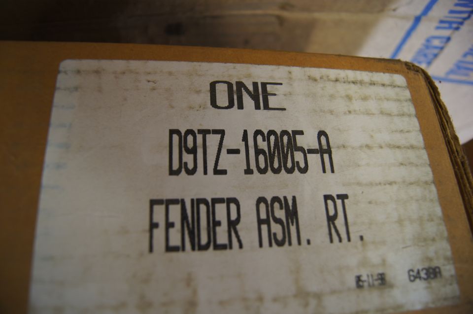 Cardboard box labeled D9TZ-16005-A FENDER ASM. RT