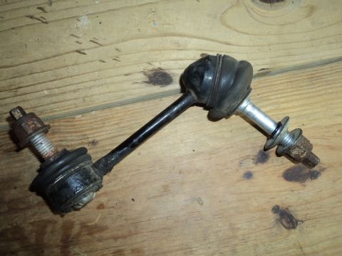 2004 Mercury Grand Marquis - Sway bar end link shown on a wooden surface.