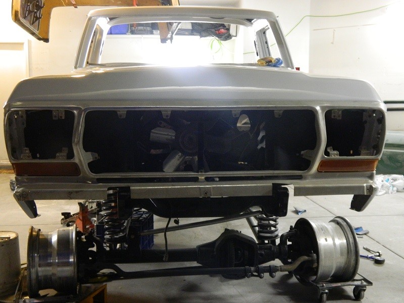 1979 Ford Bronco front clip and chassis, undergoing restoration, with front axle and wheels removed
