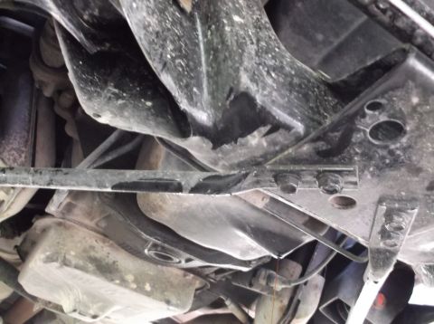1999 Mercury Grand Marquis - Underside view of a vehicle's chassis, showing the exhaust system and oil pan.