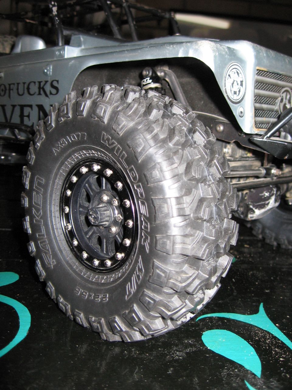 Falken Wildpeak tire on a remote control rock crawler, showing text on the sidewall