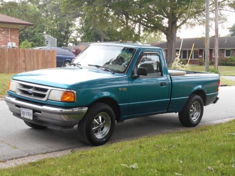 1997 Ford Ranger - A teal 1997 Ford Ranger pickup truck is shown from the driver's side 3/4 front angle.