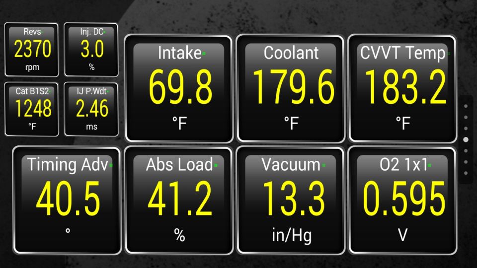 Dashboard gauges showing RPM, intake temperature, coolant temperature, and other engine data